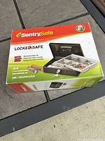 Box of Sentry Safe CB-10 showing product features and branding.