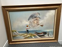 Framed original oil painting showing entire artwork with boy on beach and large sea captain face in sky.
