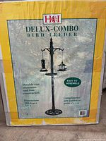 Box front showing image and details of HOI Deluxe-Combo Bird Feeder with product dimensions and features.