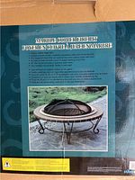 Photo of package back showing features and specifications of the marble copper fire pit with mesh screen and poker.