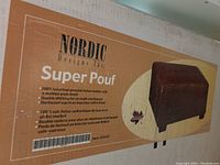 Photo of box detailing brand, model, leather quality, stitching and leg finish for the ottoman.