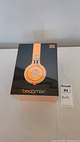 Front of sealed Beats Mixr box showing orange headphones image