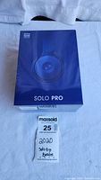 Front of sealed box showing Solo Pro name and image of Dark Blue headphones.
