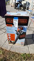 Box of Black and Decker 40V cordless sweeper/vacuum showing full product packaging and branding.