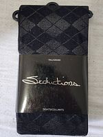 Front view of Seductions stockings packaging showing brand name and argyle design