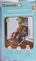 Front side of unopened pullout cookware organizer box showing product image and description in multiple languages.