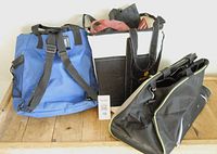 Overall view of three tote bags of various sizes and colors on a wooden surface.