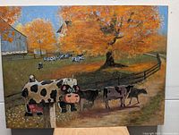 Front view of original signed farm painting on wood panel showing cows, barn, and autumn trees