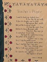 Close-up photo showing the text and floral border of one Teacher's Prayer print.