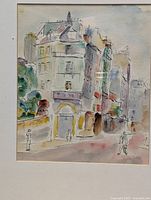 Front view of the watercolor painting showing an urban street with buildings, trees, and pedestrians, signed by the artist.