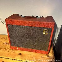 Front view showing red tolex, grille cloth and gold ‘B’ logo