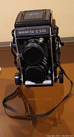 Front view of Mamiya C330 showing twin lenses and model badge
