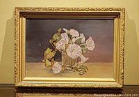 Frontal view of the oil painting showing pink flowers on a board with a gold detailed frame.