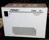 Front view showing Peavey branding, model PMA 70+ and power switch with ventilation grille.