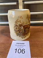 Front view of the antique Mettlach Villeroy & Boch beer stein showing detailed painted deer in forest scene.