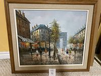 Full view of the framed oil painting showing a Paris city street, pedestrians, and the Arc de Triomphe in the background.