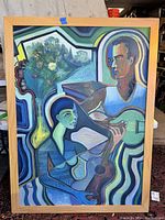 Full view of the oil painting showing two stylized figures with guitars and floral still life in the background, framed in light wood.