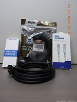 Photo of all cables and adapters together showing packaging and cables coiled
