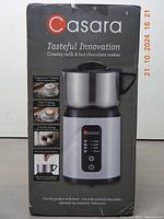 Front and top view of the Casara milk frother box showing product name, sleek stainless steel jug, control buttons with multiple beverage settings and brand logo.