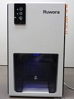 Front view of Ruwora dehumidifier showing control panel and water tank compartment