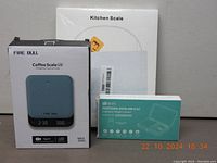 Three boxed digital scales: Fire Bull Coffee Scale, VitaFit Kitchen Scale, Brifit Mini Scale