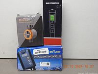 Boxed Diivoo Mechanical Water Timer, BN-LINK Digital Cooling Temp Controller, and Multifunction Digital Meter, all sealed in original packaging.