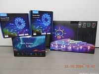 Two boxes of Govee RGB LED Strip Lights and one large box with light bulb icon showing LED strip lights.