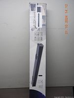 Side view of the Vmai X-bar sound bar box showing product features such as 2.1CH, ARC, 90W power, AUX input.