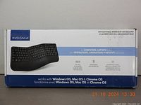 Closed retail box showing the Insignia Ergonomic Wireless Keyboard designed for computers and laptops, highlighting full keyboard layout and OS compatibility.