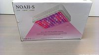 Front side of the packaging showing the Noah-S brand and a picture of the LED grow light emitting purple light.
