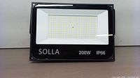 Front view of Solla 200W IP66 LED floodlight showing LED grid and product markings.
