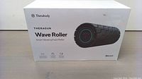 Front of the Therabody Theragun Wave Roller box showing product image and branding.