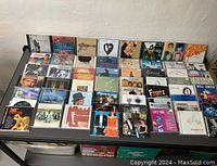 Top view of CD covers arranged in rows, showing album artwork and titles.