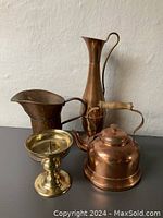 Set of all items together showing relative size and finish