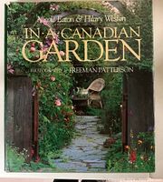 Front cover of 'In a Canadian Garden' showing a lush garden path framed by a wooden gate with flowers and a chair in the background.