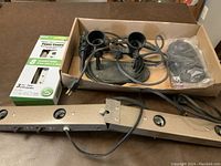 Photo of the brand new digital timer power centre box alongside vintage floor lamp parts including sockets, wires, and a metal mounting bar.