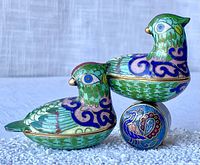 Two green Asian cloisonne bird trinket boxes, side view showing layered enamel and gold details