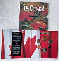 front of tri-fold booklet showing reverse of Canadian coins on a flag background and introductory information