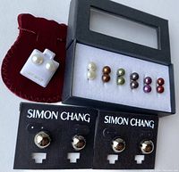 Overview photo showing all earrings including the 14 KT gold white pearls, Simon Chang pairs, and the boxed set of six colored pearl pairs.