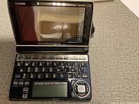 Top view of Casio EX-word XD-A4000 electronic dictionary showing screen, keyboard, and control buttons