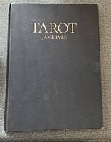 Cover of the hardcover black book with the title 'TAROT JANE LYLE' in gold letters.