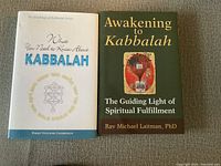 Front covers of two hardcover books about Kabbalah showing titles, authors, and cover designs.