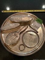 Top-down view of all five items arranged on tray with measuring tape