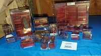 Full set of cherry finish miniature furniture pieces displayed in boxes showing variety and quantity in lot.