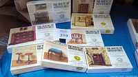 Eight boxed miniature furniture kits from The House of Miniatures, arranged together showing various furniture designs.