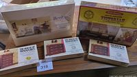 Lot of five miniature furniture kits: Heritage Collection Music Room, Victorian Living Room, and three House of Miniatures Chippendale chest kits.