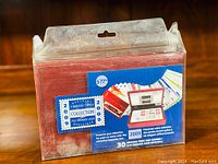 Photo of wooden box sealed in cellophane with label showing 'Official 2009 First Day Cover Collection' and price sticker.