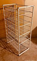 Full view of the ClosetMaid 5 basket wire drawer storage rack, white finish, showing five pull-out wire basket drawers in metal frame.