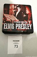 Metal tin box with Elvis Presley holiday photo cover.