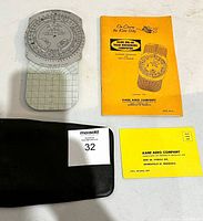 Photo of Kane MK-6B Dead Reckoning Computer with yellow manual and black case